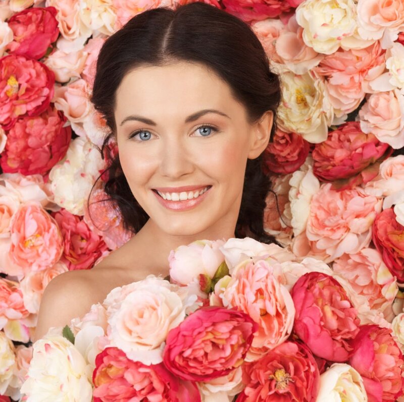 Woman Surrounded by Flowers — Pink, Serene, Photograph