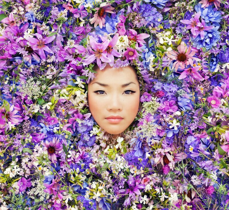 Woman Surrounded by Flowers — Purple, Serene, Photograph