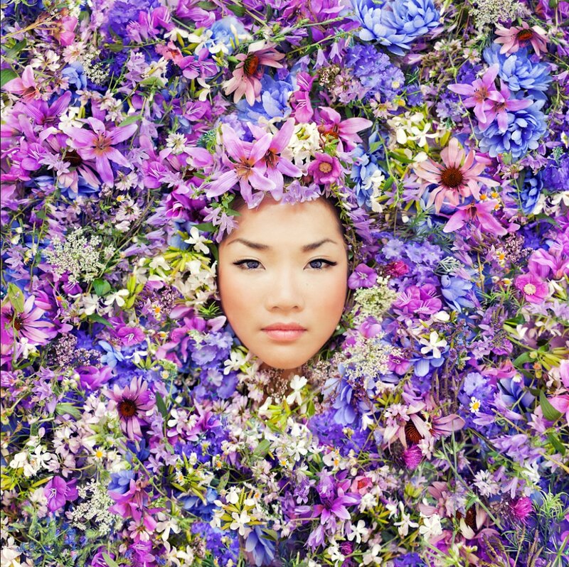 Woman Surrounded by Flowers — Purple, Serene