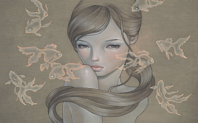 woman surrounded by goldfish