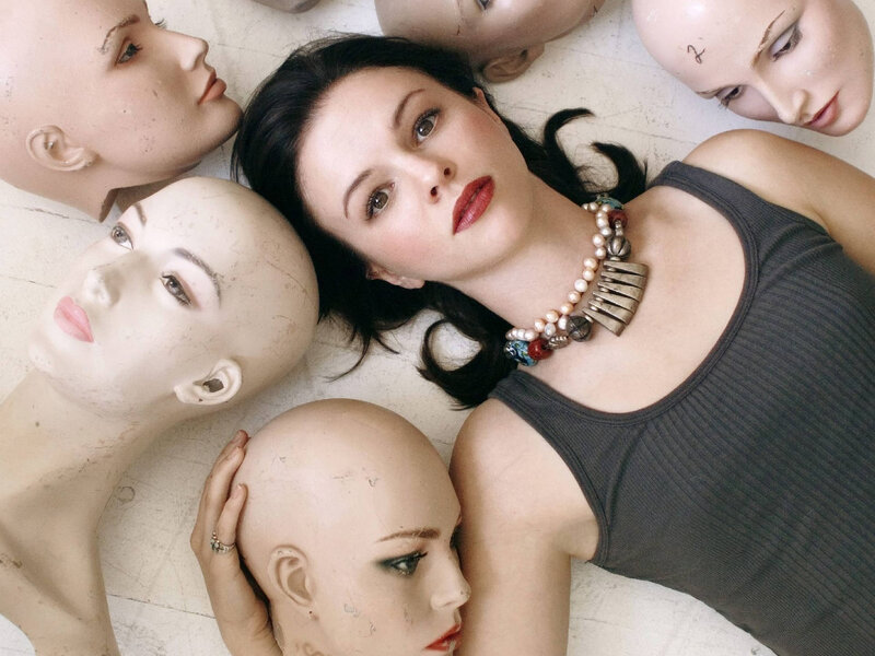 Woman Surrounded by Mannequins