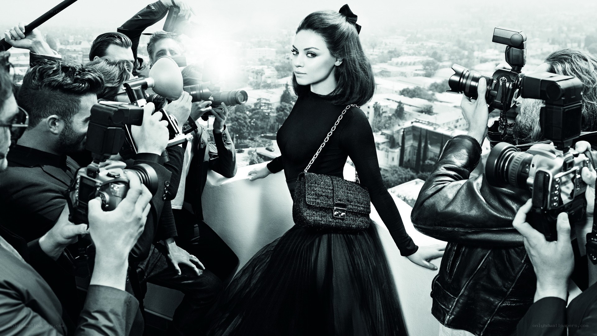 woman surrounded by photographers
