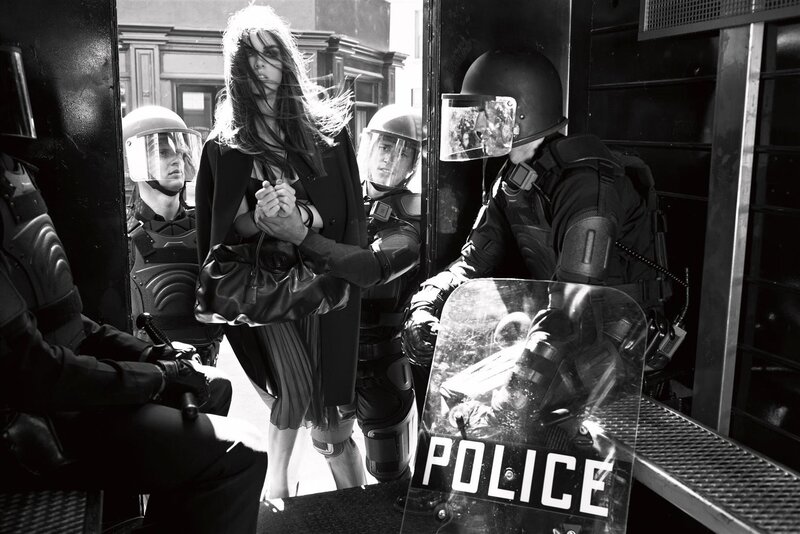 Woman surrounded by police