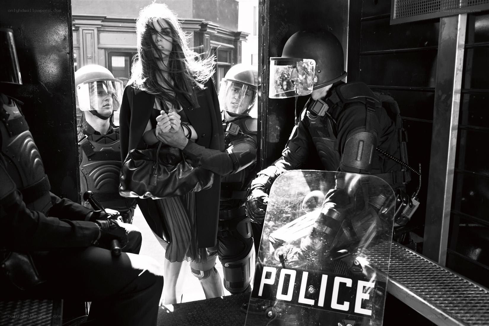 Woman surrounded by police