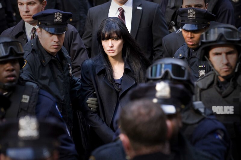 Woman surrounded by police