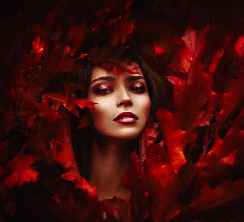 Woman Surrounded by Red Leaves