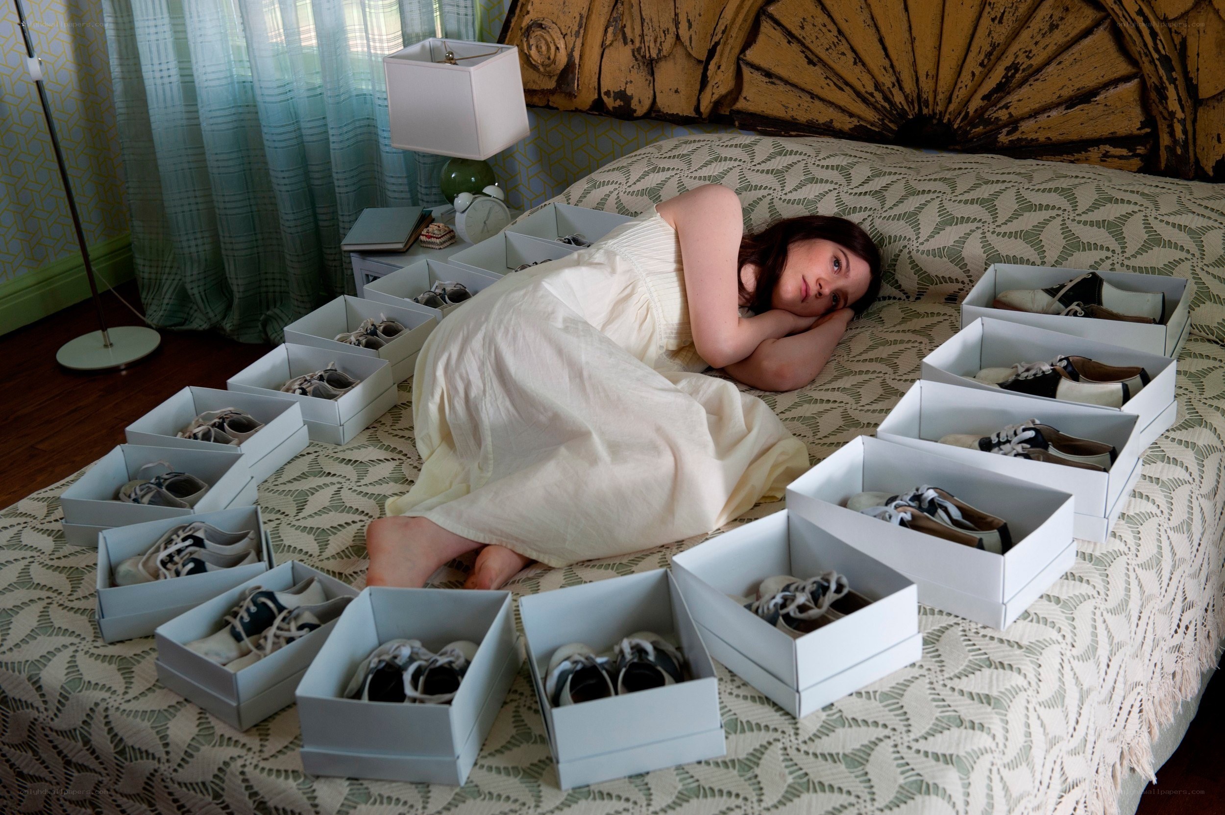woman surrounded by shoe boxes