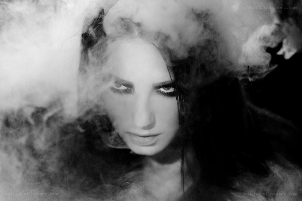 woman surrounded by smoke