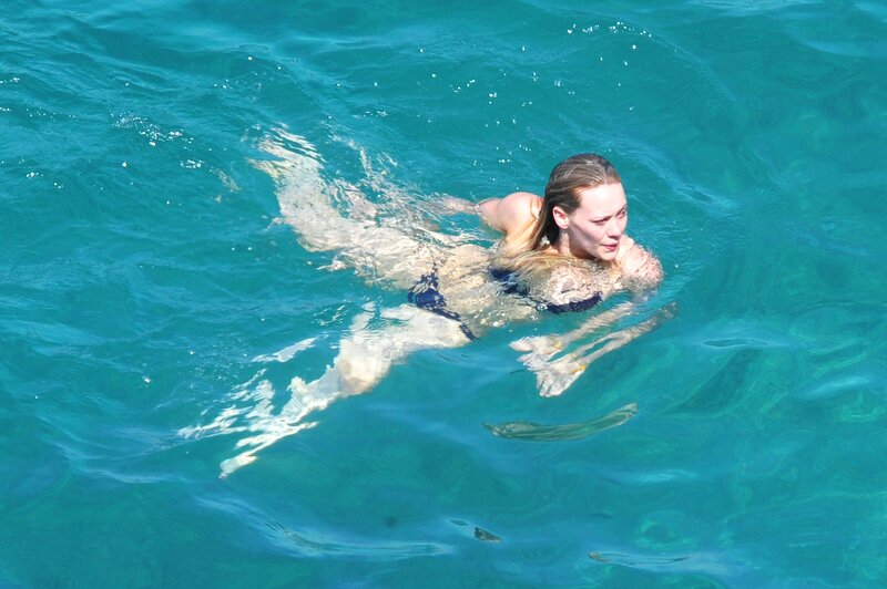 woman swimming in blue water