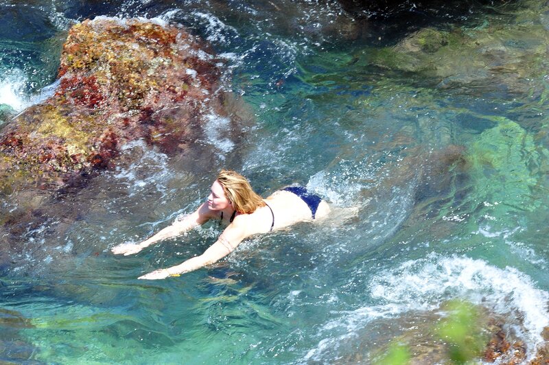 woman swimming in clear water