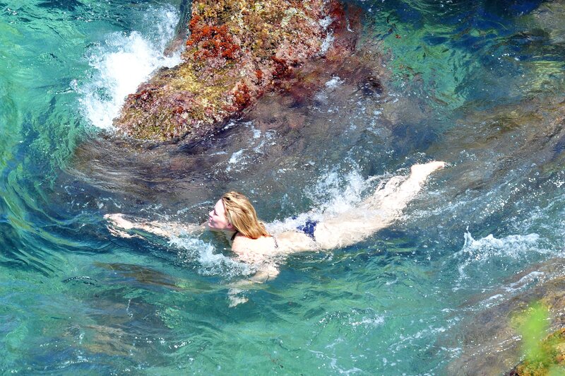woman swimming in clear water