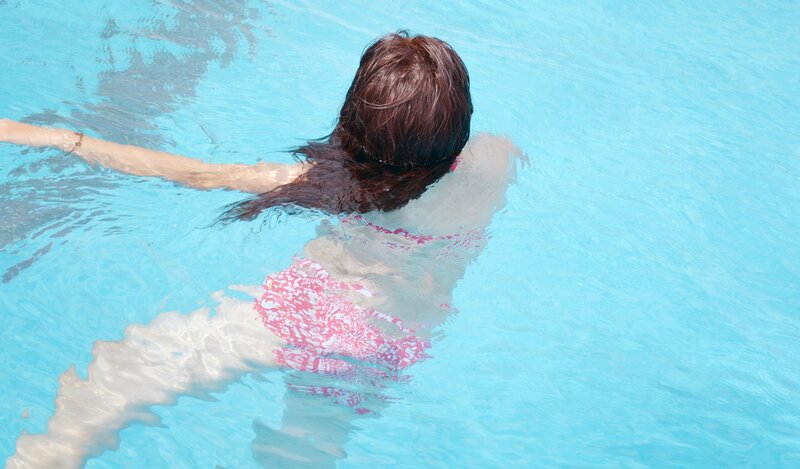woman swimming in pool