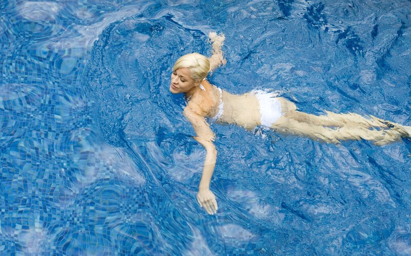 woman swimming in pool