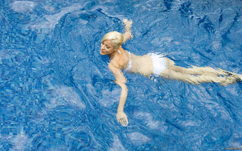 Woman Swimming in Pool — Blue