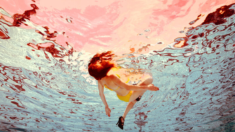 woman swimming underwater