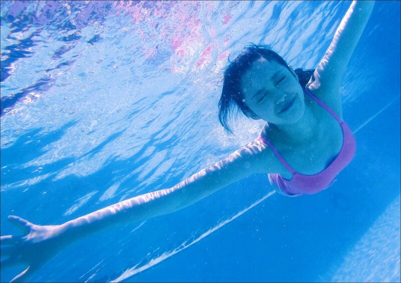 woman swimming underwater