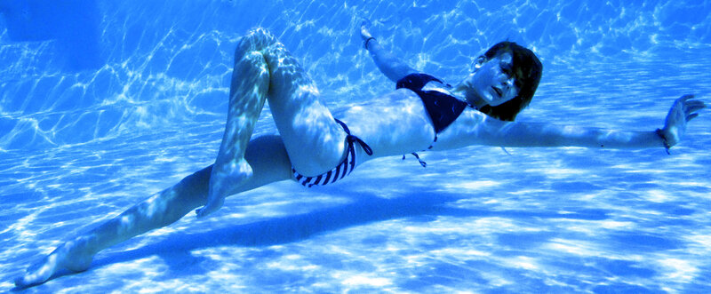 woman swimming underwater