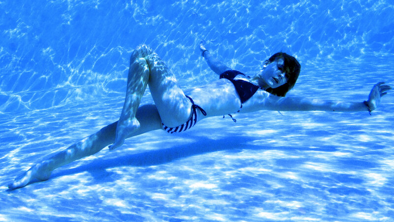 woman swimming underwater