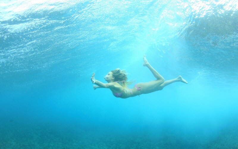 woman swimming underwater