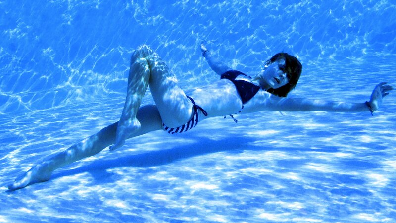 woman swimming underwater