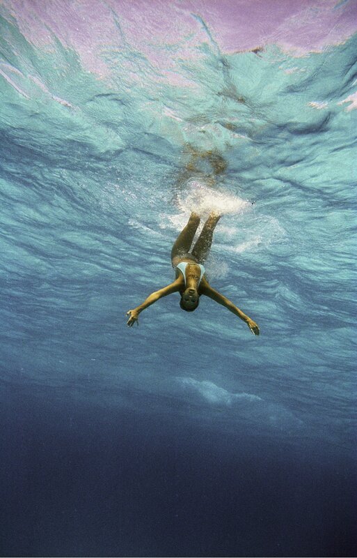 woman swimming underwater