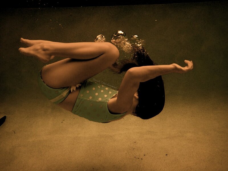 woman swimming underwater