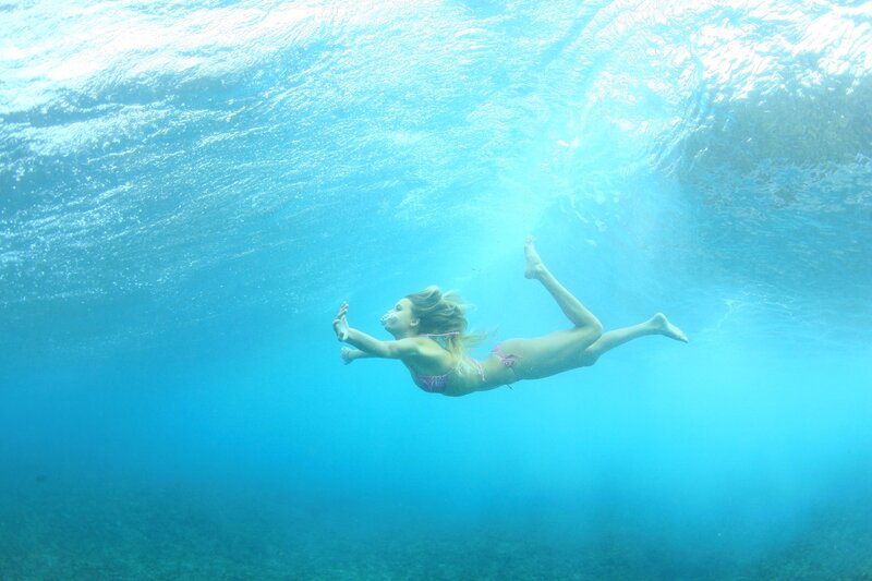 woman swimming underwater
