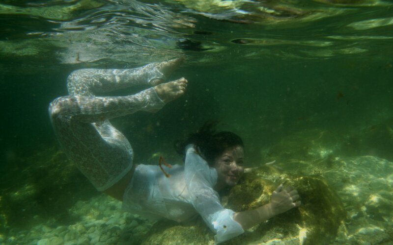 woman swimming underwater