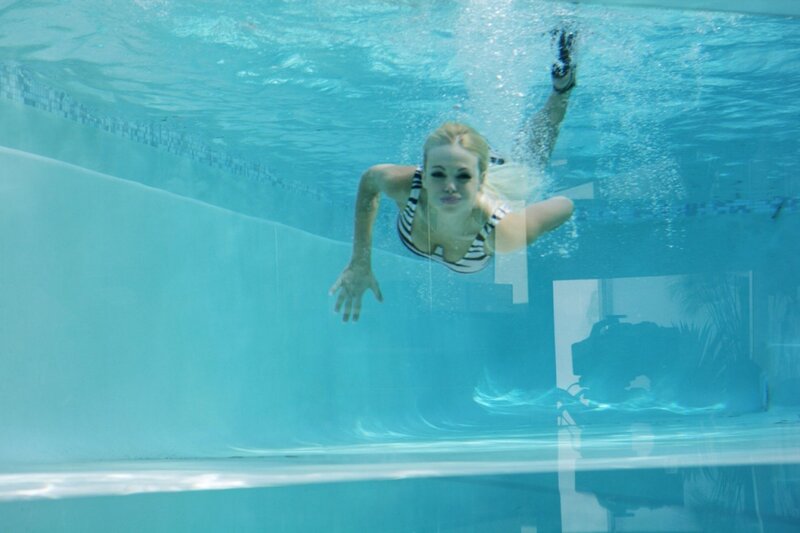 woman swimming underwater