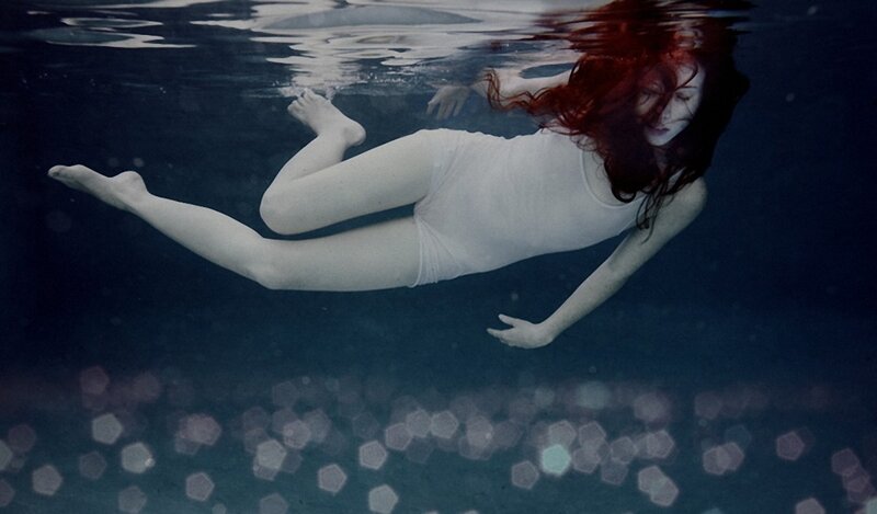 woman swimming underwater
