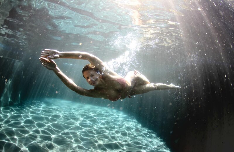 woman swimming underwater