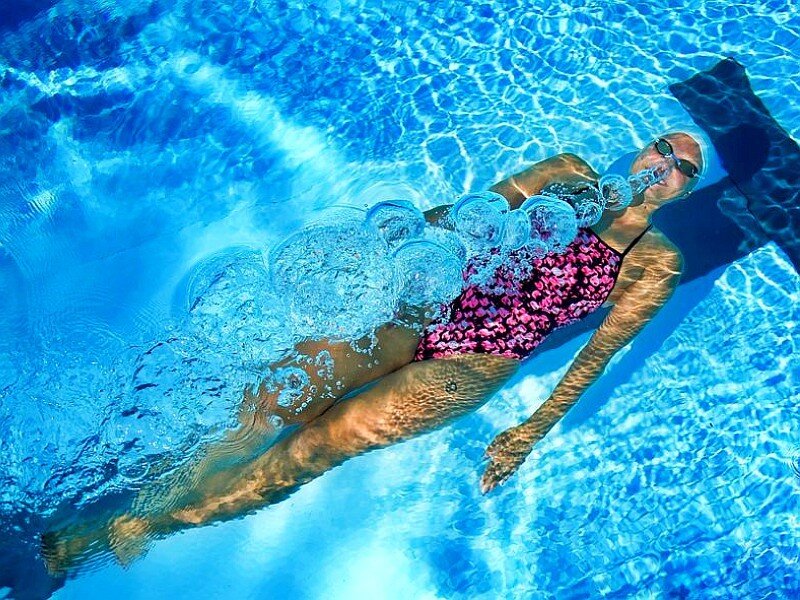woman swimming underwater