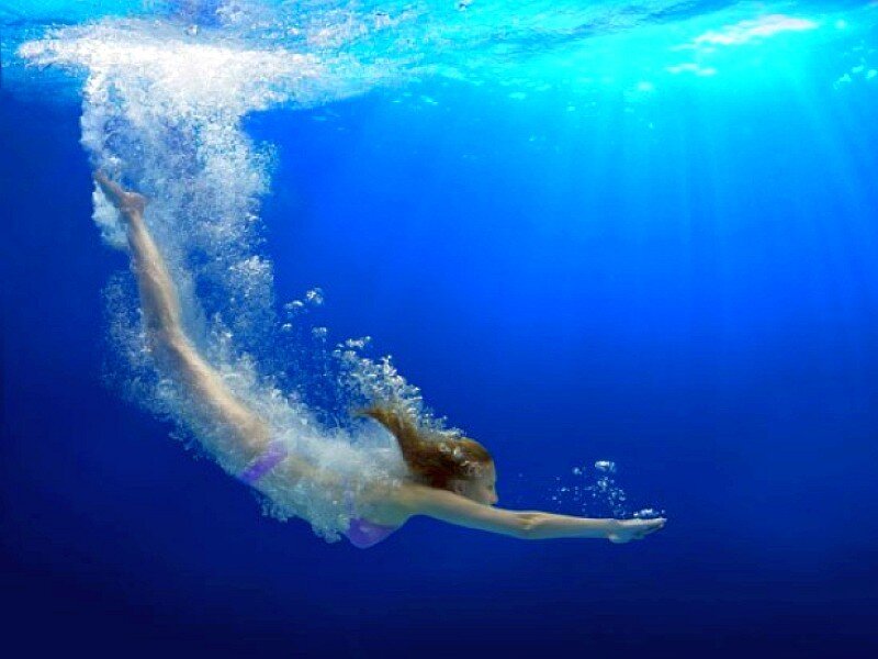 woman swimming underwater