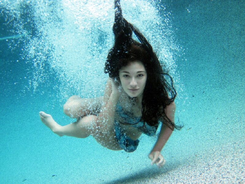 Woman Swimming Underwater — Blue, Calm, Photograph, Bubbles
