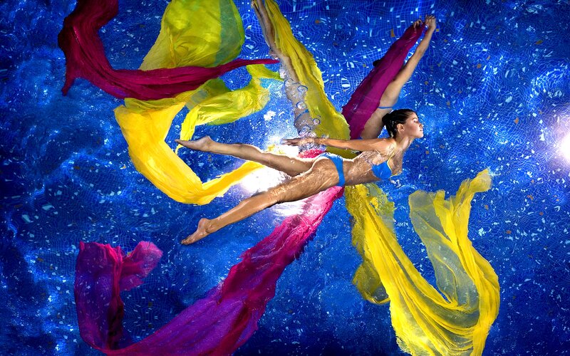 Woman Swimming Underwater — Blue, Dramatic, Photograph