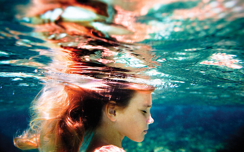 woman swimming underwater