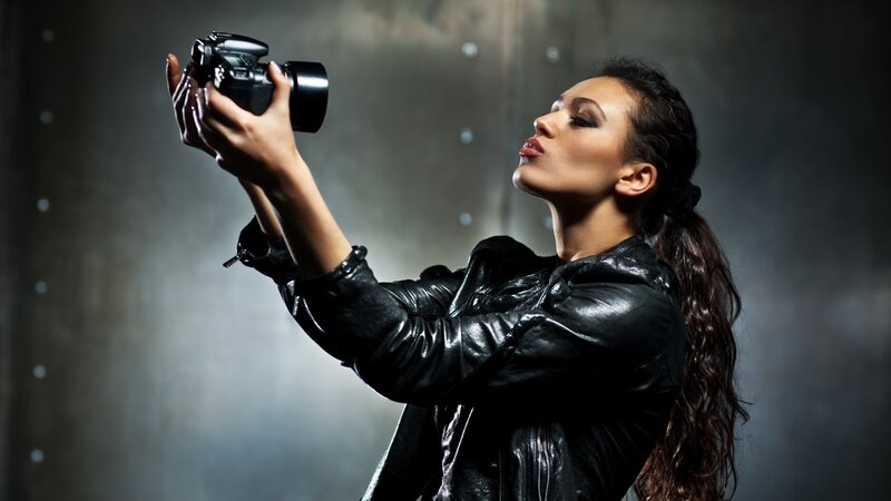 Woman taking a photo with camera