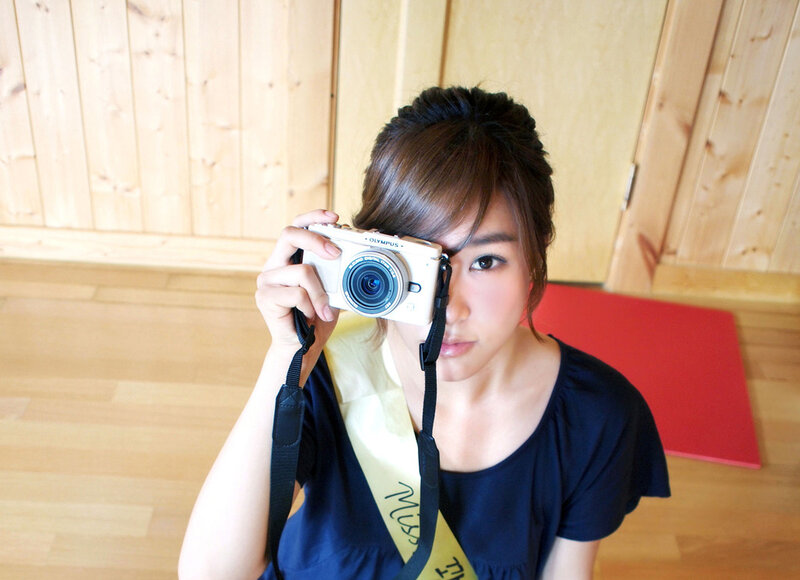 woman taking a photo with camera