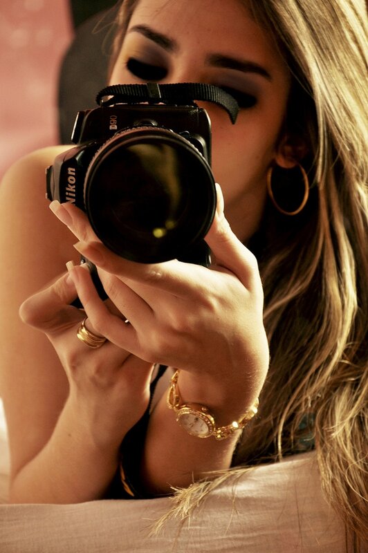 woman taking a photo with camera