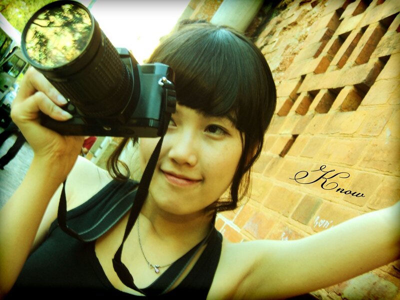Woman taking a photo with camera