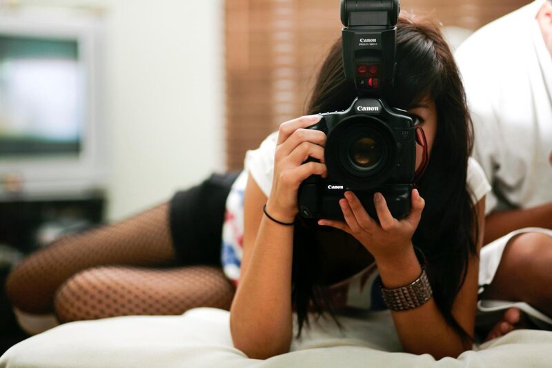 woman taking a photo with camera