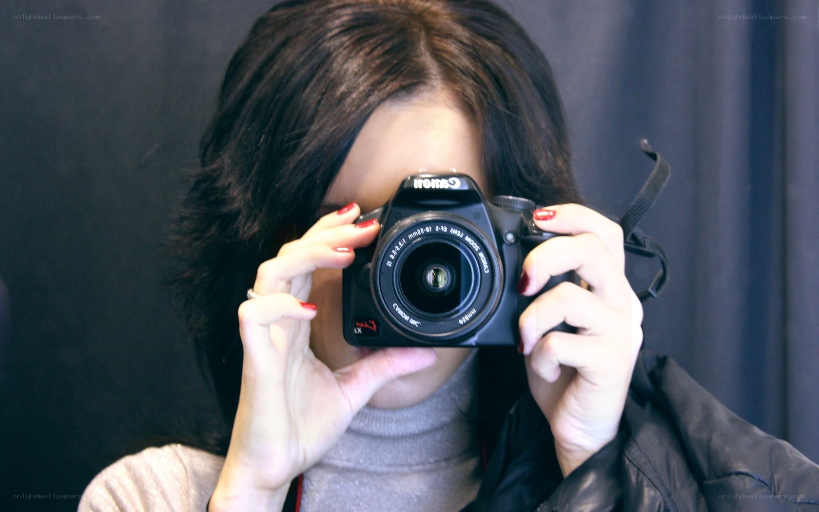 woman taking a photo with camera