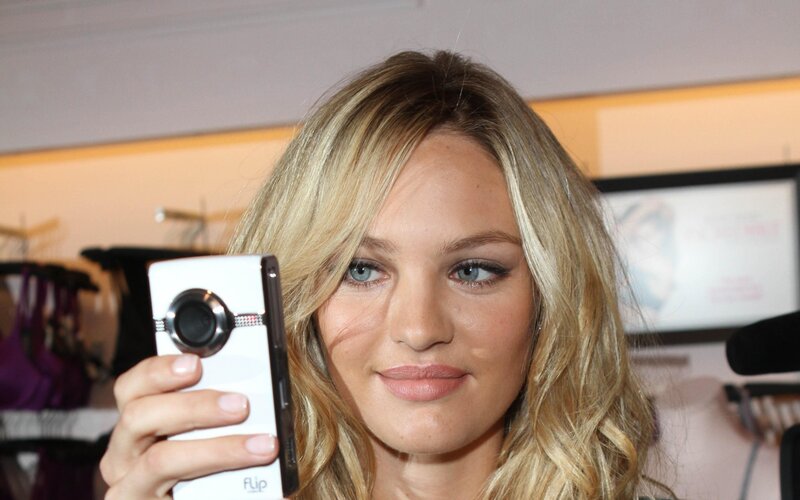 Woman taking a selfie with phone
