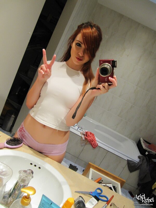 woman taking mirror selfie