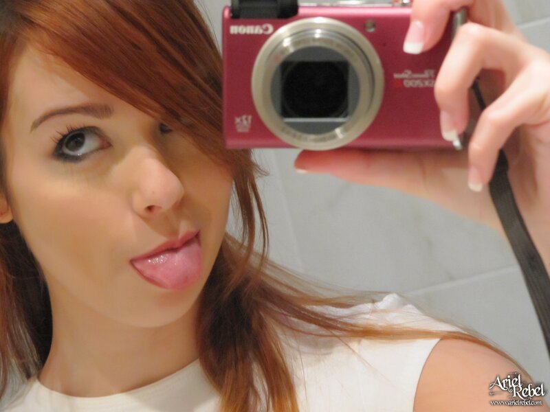 woman taking mirror selfie
