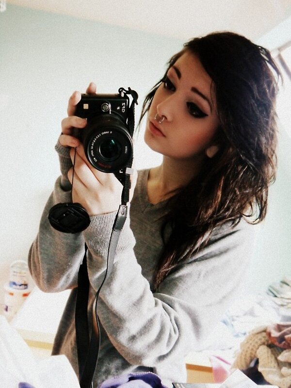 woman taking mirror selfie