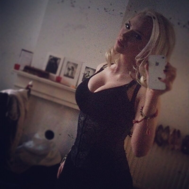 woman taking mirror selfie