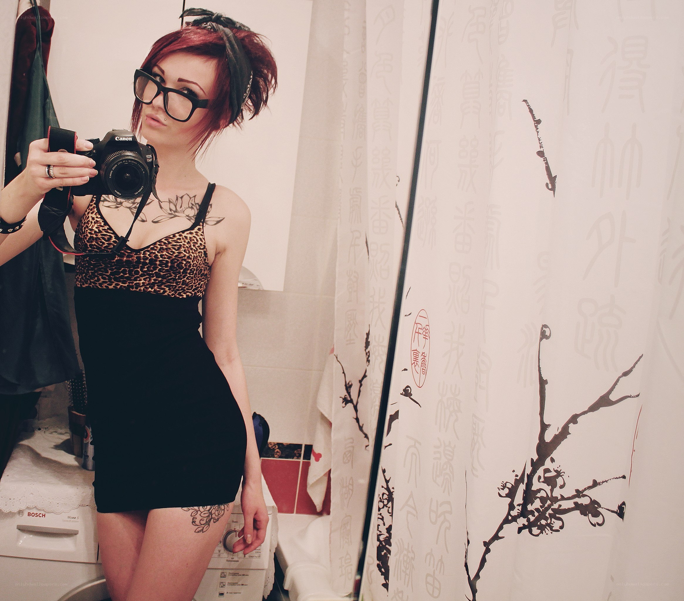 woman taking mirror selfie