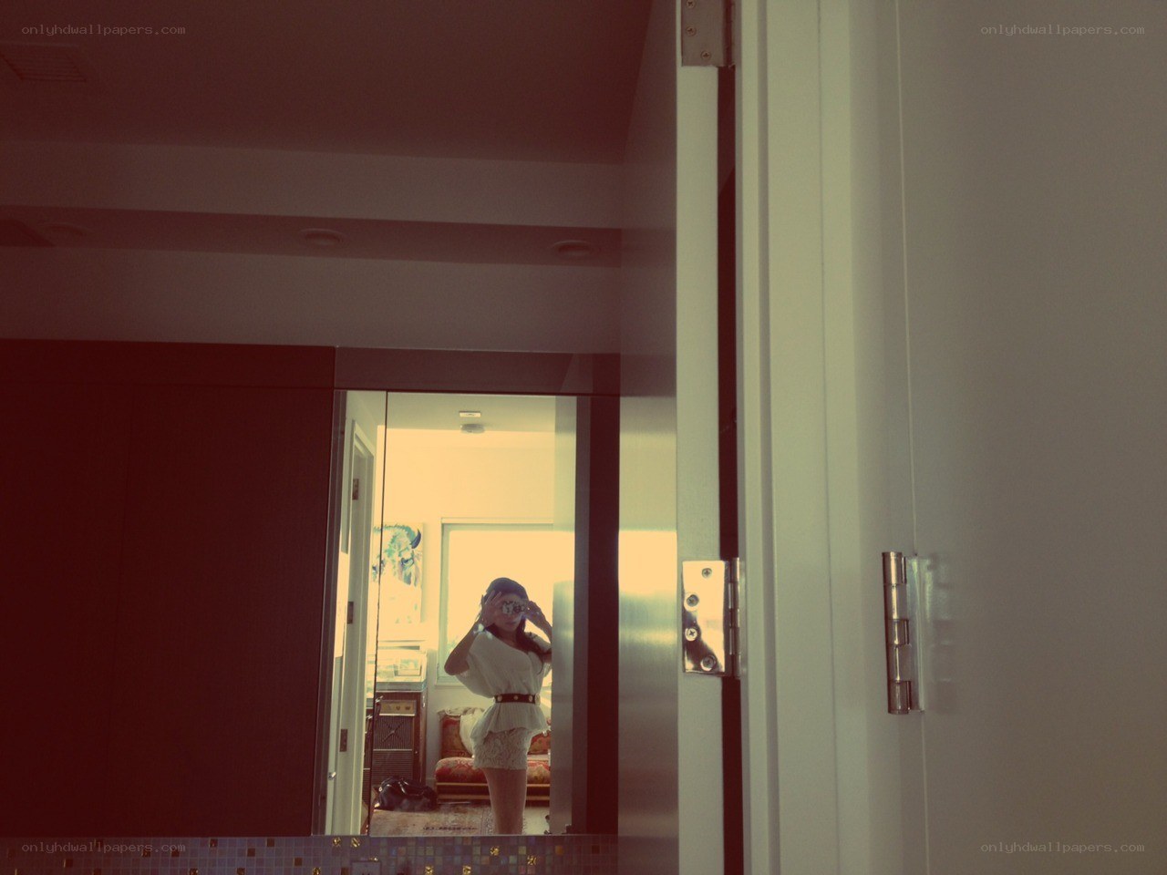 woman taking mirror selfie
