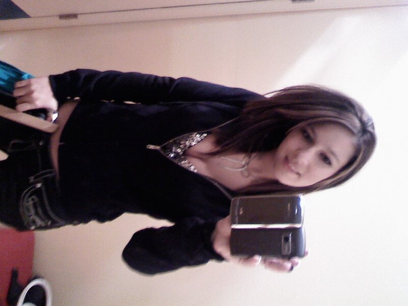 woman taking mirror selfie